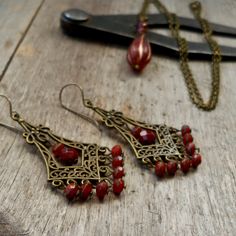 The little rustic orange beads on these earrings, are what started the whole thing! These earrings are a little pop of color for your ears in my same rustic boho style. I have other items listed and there are probably going to be more. I love these little beads.  This listing is for the chandelier earrings only. The other items are listed separately. The beads on these are 3 x 5mm in size. They are high quality Czech glass. The ear wire, as shown, is a pure titanium ear wire. Titanium is perfect Dangle Beaded Brass Earrings For Gifts, Beaded Dangle Brass Earrings For Gifts, Beaded Dangle Earrings In Brass As A Gift, Gift Brass Beaded Dangle Earrings, Vintage Metal Beaded Earrings For Gift, Vintage Pierced Drop Beaded Earrings, Vintage Teardrop Chandelier Earrings As Gift, Copper Beaded Teardrop Earrings For Gifts, Copper Beaded Dangle Earrings As Gift