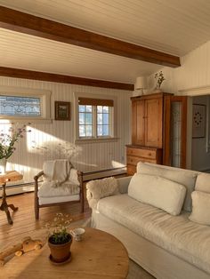 a living room filled with furniture and wooden floors