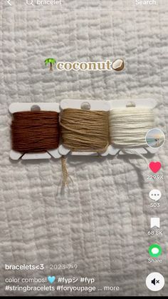 two spools of thread on top of a white sheet with the words coconut