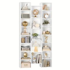 a white bookcase with many different items on it's shelves and the letter n