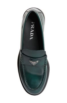 Prada's iconic triangular logo shines on a brushed calfskin-leather loafer defined by its refined, minimalist design. 1" (25mm) heel (size 8.5US/38.5EU) Leather upper and lining/rubber sole Made in Italy Designer Shoes Prada Triangle, Loafer Women, Triangle Logo, Carrie Bradshaw, Prada Shoes, Anniversary Sale, Leather Loafers, Loafers For Women, Shades Of Green