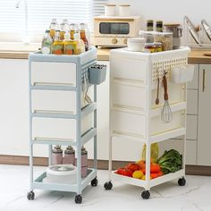 a kitchen cart with food in it next to a counter top and microwave on the other side