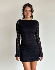 In a black regal lace, the Sevila dress features a mini, bodycon silhouette with long, flared sleeves and a boat neckline. Complete with scalloped hem detailing on a fully lined body. Lace Top Mini Dress, Sweater Dress Outfits, Lace Long Sleeve Mini Dress, Long Sleeve Prom Dress Lace, Long Sleeve Black Dress, Black Dress With Lace, Elsa Dress, Motel Rocks, Dress Aesthetic