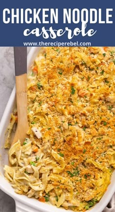 chicken noodle casserole in a white dish with a wooden spatula