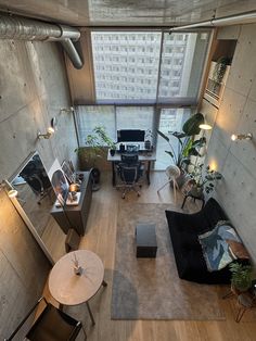 an aerial view of a living room and office space