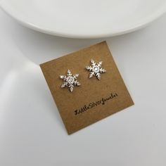 Snowflake Earring Studs Made from solid sterling silver, cubic zirconia. Size: approximately 10.5mm Sold as a pair Comes with gift box Sterling silver butterfly earring backs, and extra couple pairs of silicon earring backs will be included. Hypoallergenic, safe for sensitive skin. FOR HYGIENE REASONS, PLEASE NO RETURNS ON THE EARRINGS. BUT PLEASE CONTACT US IF YOU ARE NOT SATISFIED WITH YOUR PURCHASE. CUSTOMER SATISFACTION IS THE NUMBER ONE PRIORITY IN OUR SHOP! Snowflake Sparkling Earrings For Gift, Cubic Zirconia Snowflake Earrings For Gift, Silver Butterfly Earrings, Butterfly Earring, Snowflake Earrings, Silver Snowflakes, Earrings Christmas, Earring Studs, Silver Butterfly