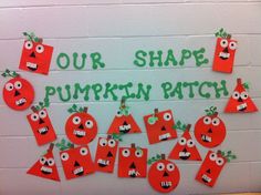 a bulletin board with cut out pumpkin faces and words that say our shape pumpkin patch