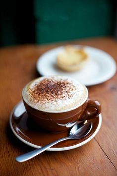 there is a cappuccino on the saucer