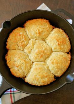 a cast iron skillet filled with biscuits