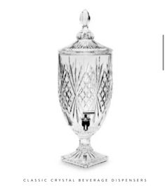 an ornate glass vase with the words classic crystal beverage dispensers on it