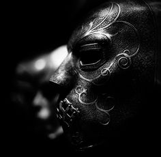 a black and white photo of a mask