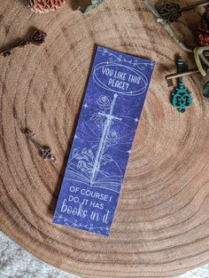 a blue bookmark sitting on top of a wooden table