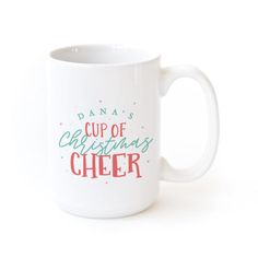 a white coffee mug with the words dana's cup of christmas cheer on it