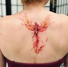 a woman with a tattoo on her back