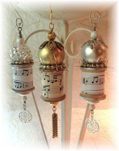 three christmas ornaments with musical notes on them