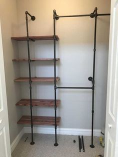 the closet is empty and ready to be used as a storage area for books or other items