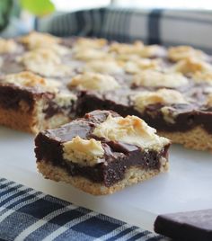 chocolate and marshmallow bars on a cutting board