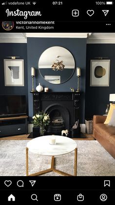 a living room with blue walls and furniture