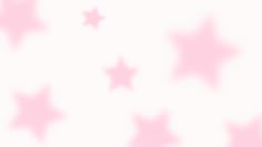 pink and white stars are flying in the air