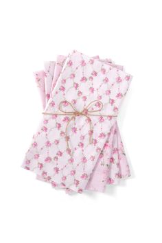 four napkins with pink flowers on them