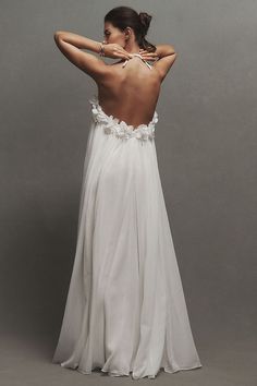 the back of a woman in a white dress