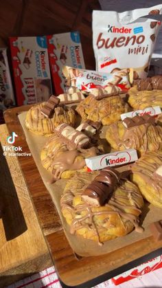 some kind of dessert sitting on top of a cutting board next to boxes of milk