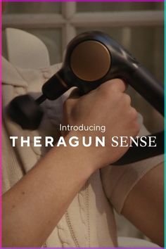 a woman holding a hair dryer in her hand with the words,'theragun sense'over it