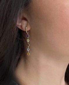 14K yellow gold huggie hoop multi-color bezel set long drop earrings with amethyst, peridot, blue topaz and citrine. 🌈 Shop more drop earrings here ✈️ Choose free shipping at checkout ☎️ Call 201-722-0216 with questions 💭 Chat with us live! Bottom right corner of your screen Cheap Multicolor Drop Earrings, Cheap Colorful Drop Earrings, Gold Drop Earrings Coulered Stone, Topaz And Citrine, Long Drop Earrings, Bezel Setting, Blue Topaz, Citrine, Topaz