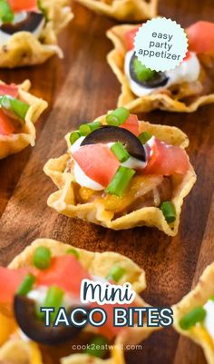 mini taco bites on a wooden board with text overlay that reads easy appetizer