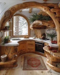 a kitchen with wooden cabinets and an arched window in the center is filled with potted plants