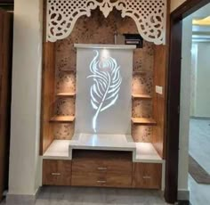 a display case with an intricate laser cut design on the front and back wall, along with shelving units