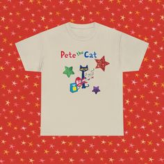 a white t - shirt that says pet the cat with colorful stars on red background