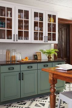 1 Affordable Product Made This Jaw-Dropping DIY Kitchen Makeover Possible Galley Kitchen Black Countertops, Diy Paint Cabinets Kitchen, Pistachio Kitchen Cabinets, Green And Black Kitchen, Orange Kitchen Cabinets, Pistachio Kitchen, Kitchen Cabinets Vintage, Sage Green Kitchens, Condo Makeover