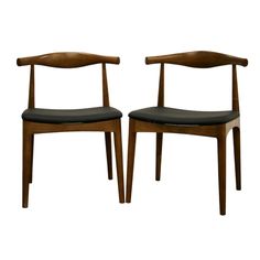 a pair of wooden chairs with black leather seats