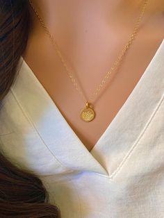 This is a gorgeous Gold Vermeil hand stamped lotus disc necklace. A precious necklace to add to your collection or gift to a friend, mother, or yoga enthusiast. - Pendant - Gold Vermeil  - Chain + Components - 14k Gold Fill - Lobster Clasp - 14k Gold Fill Also available in silver: https://www.etsy.com/listing/182938743/sterling-silver-stamped-lotus-disc Pair this disc necklace with the Itty Bitty Gold Disc necklace: https://www.etsy.com/listing/119133836/itty-bitty-gold-disc-necklace-gold . . . Delicate Charm Necklace With Round Coin Pendant, Round Disc Coin Pendant Jewelry Gift, Spiritual Jewelry With Heart Charm Round Pendant, Dainty Round Pendant Charm Necklace As Gift, Dainty Round Pendant Charm Necklace For Gifts, Classic Heart Pendant Jewelry With Flower Charm, Heart-shaped Charm Necklace With Flower For Gift, Heart-shaped Flower Charm Necklace For Gift, Everyday Round Heart Necklace For Mother's Day