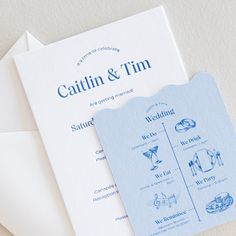 two wedding programs are laying on top of an envelope