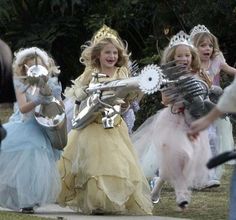 several children dressed up as princesses in costume