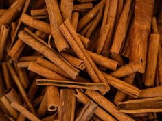 cinnamon sticks are piled on top of each other