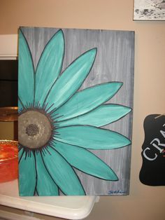 an image of a blue flower painted on canvas