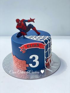 a spiderman birthday cake with the number three on it