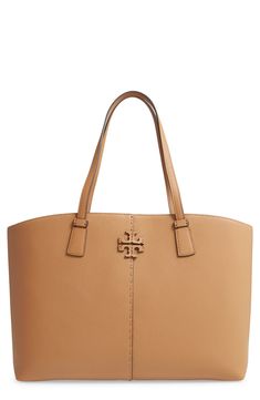 From its elongated handles to the stacked-T logo, the McGraw is the perfect-and spacious-tote for your busy lifestyle. Style Name:Tory Burch Mcgraw Leather Tote. Style Number: 6010725. Available in stores. Timeless Tan Shoulder Bag For Everyday Use, Tan Tote Shoulder Bag With Removable Pouch, Tan Tote Shoulder Bag With Top Carry Handle, Tan Tote Bag With Branded Hardware, Tan Tote Shoulder Bag With Gold-tone Hardware, Tan Shoulder Bag With Gold-tone Hardware, Classic Tan Shoulder Bag For Everyday Use, Tan Shoulder Bag With Handle Drop For Shopping, Classic Tan Bags For Errands