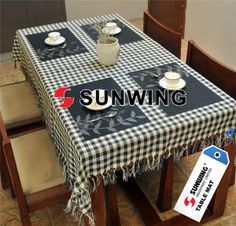 the table is covered with a black and white checkered tablecloth, which reads sunwing