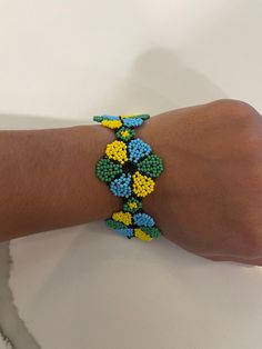 Beautifully hand made  Colorful and unique  Tell me in the notes which one you would like. Handmade Colorful Flower Bracelets, Handmade Colorful Flower Shaped Bracelets, Handmade Multicolor Flower Bracelets, Handmade Green Beaded Bracelet, Handmade Flower-shaped Multicolor Bracelets, Handmade Green Flower Beaded Bracelets, Handmade Multicolor Flower Bracelet, Unique Multicolor Flower Bracelet, Handmade Colorful Beaded Bracelets With Round Beads