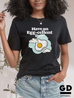 "Express your style with our exclusive HAVE AN EGG-CELLENT DAY! statement tee on a soft, breathable cotton Bella+Canvas t-shirt. This terrific tee, with its light hand feel, offers everyday comfort and a wear-everywhere appeal. DETAILS + FEATURES - Fit: Relaxed - Style: Unisex Adult (available in sizes S-XXL) - Sizing: Runs true to size. Refer to the Size Guide and Size Chart images.  Note: Unisex adult sizing falls between men's and women's traditional sizing. So, a unisex large would be bigger Funny Eggs, Gift For Chef, Brunch Shirts, Quotes Shirt, Chicken Shirt, Kindness Shirt, Farmer Shirt, Chicken Shirts, Chef Gifts