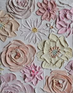 some pink and white flowers are painted on the wall with pastel colors in it