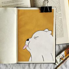 an open book with a polar bear drawn on it