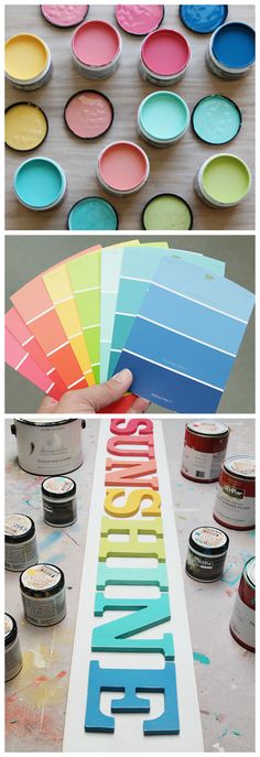 there are many different colors of paint on the table and one is being used as a sign