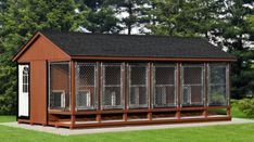 a dog kennel is shown in front of some trees