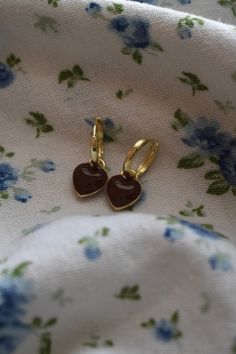 Wrap yourself in love with our Brown Heart Huggies! These delicate earrings are simply made to go with any outfit. These earrings are lightweight and comfortable for all-day wear. Size- 1.0 inch drop, Width 0.4 inches Materials - Zinc Alloy Cute Heart-shaped Earrings For Everyday Wear, Cute Everyday Earrings With Heart Charm, Cute Heart-shaped Everyday Earrings, Cute Everyday Heart-shaped Earrings, Cute Everyday Heart Charm Earrings, Hypoallergenic Brown Hoop Earrings As Gift, Heart Huggies, Chunky Jewellery, Brown Heart