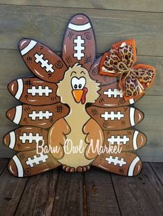 a turkey made out of footballs with the words barn owl market written on it